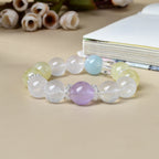 Natural milky quartz bracelet front view with amethyst focal bead citrine aquamarine silver flower spacers on beige background white roses crystal healing good luck KaiGuang