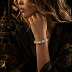 Woman wearing milky quartz crystal healing bracelet with amethyst and citrine beads silver spacers against dark luxury velvet background with antique bronze decor KaiGuang negative energy protection