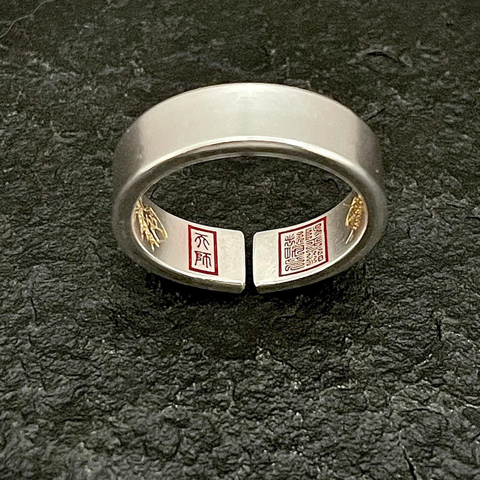 The sleek, understated matte exterior of the Taoist protection ring, showing its solid construction.
