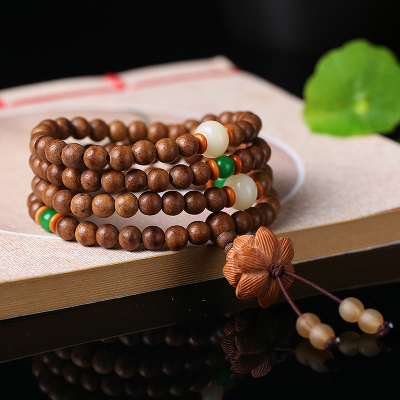 Natural agarwood beads activated to clear energy blockages and enhance Qi flow.