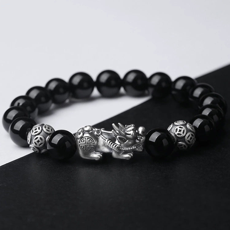 Natural obsidian Pixiu money bracelet overhead view silver guardian beads full circle Taoist KaiGuang wealth attraction
