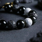Close up of natural black obsidian beads used in Taoist Kaiguang protection bracelet