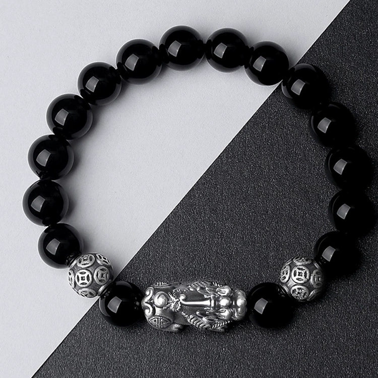 Silver Pixiu obsidian money bracelet worn by man and woman couple lifestyle shot Taoist KaiGuang wealth guardian jewelry