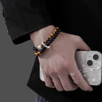 man wearing black obsidian tiger eye taoist kaiguang double layer bracelet lifestyle protection fortune activation
