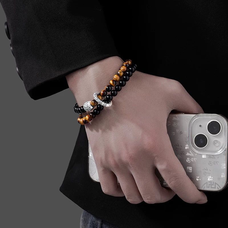 man wearing black obsidian tiger eye taoist kaiguang double layer bracelet lifestyle protection fortune activation