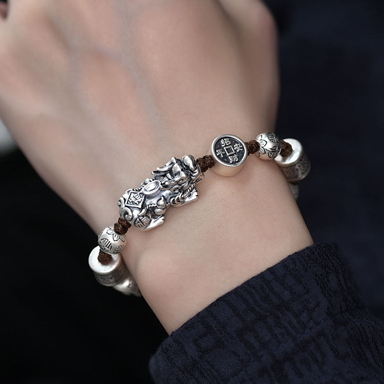 Lifestyle image showing the Pixiu wealth bracelet worn on a wrist, demonstrating real daily wear effect.