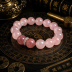Rose quartz heart chakra bracelet with strawberry quartz focal bead silver spacers on Taoist bagua plate bronze background KaiGuang self-love manifestation