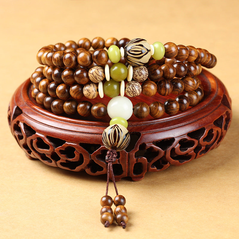 Natural Rosewood 108 mala beads bracelet for spiritual protection and meditation.