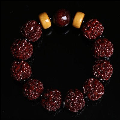 Authentic Nepal Rudraksha aura shield bracelet with natural beeswax spacer beads showing deep red patina on black background Taoist KaiGuang spiritual protection