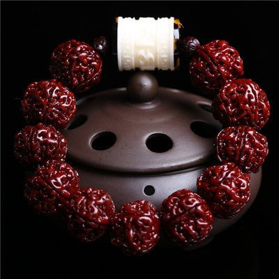 Authentic Nepal Rudraksha bracelet with white jade spacer bead on purple clay incense burner black background Taoist KaiGuang aura shield