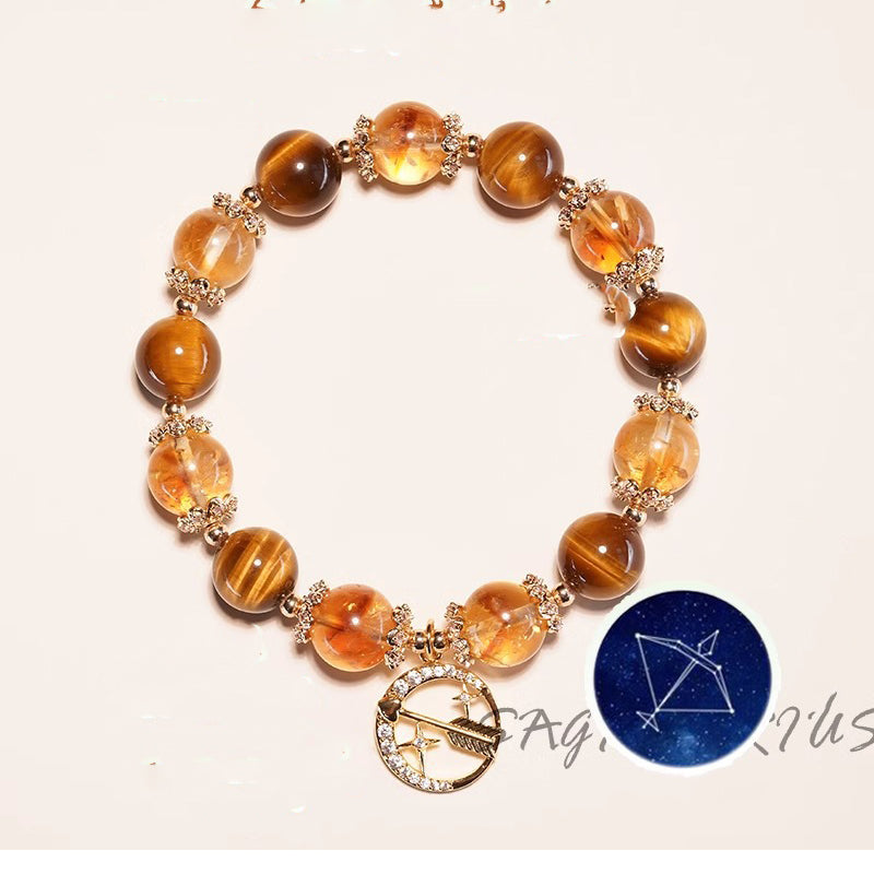Sagittarius zodiac tigers eye and citrine crystal healing bracelet with gold flower spacers and archer constellation charm Taoist KaiGuang abundance manifestation spiritual jewelry
