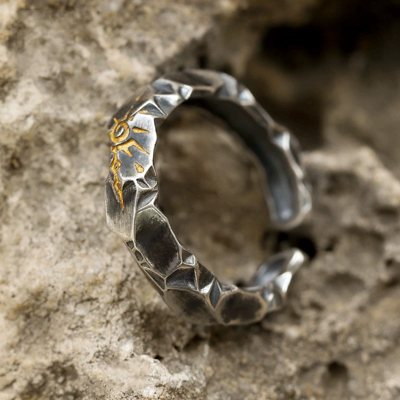 Silver sun rune ring top view full hammered band Taoist KaiGuang fortune protection ring on rock