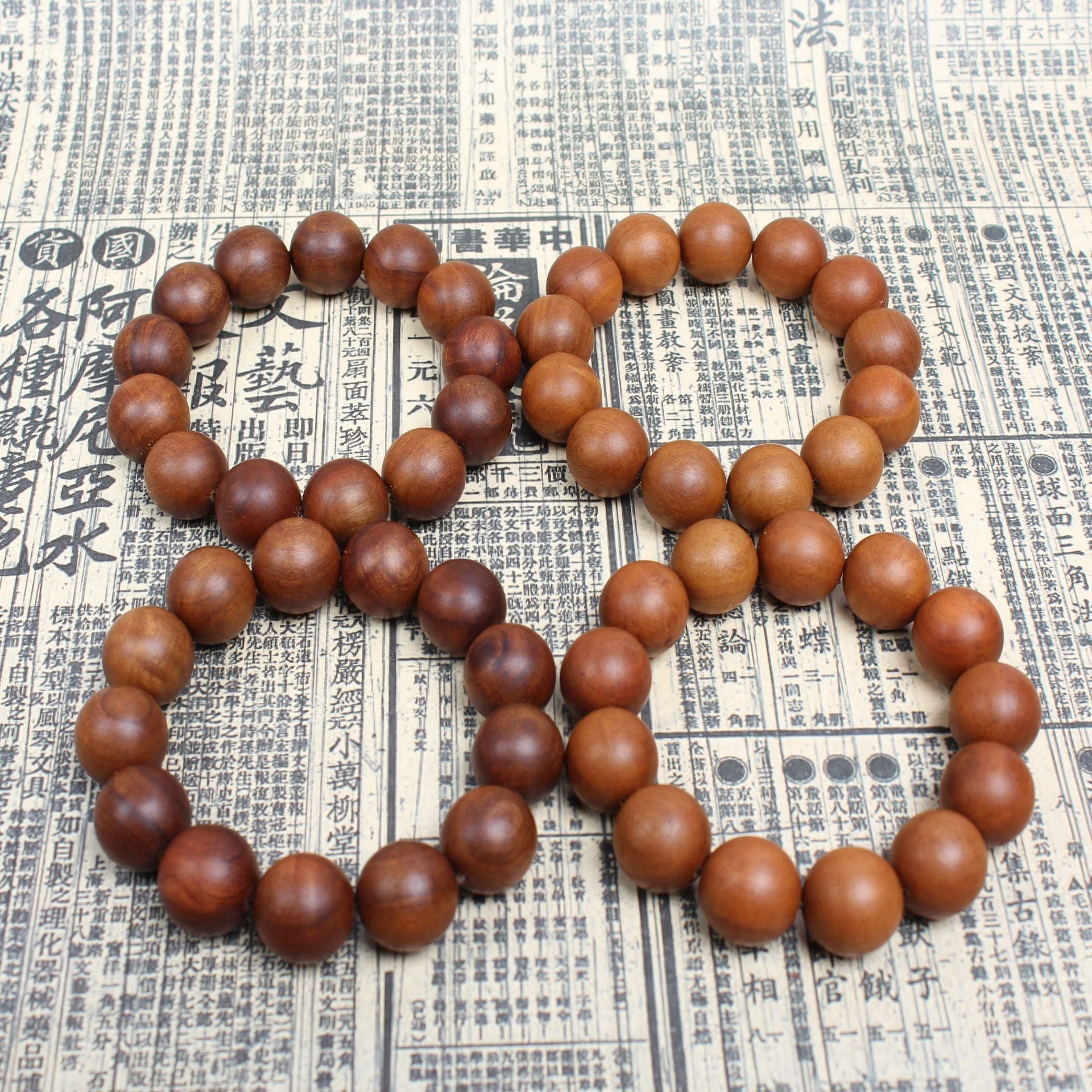 High-density dark aged wood beads for spiritual defense and protection.