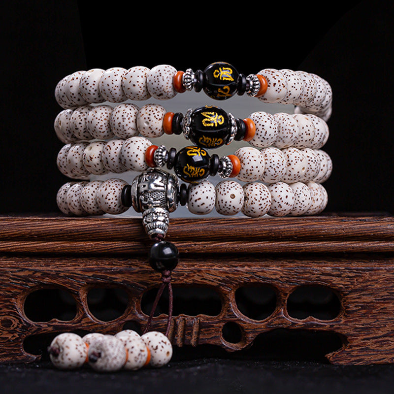Star moon bodhi 108 bead meditation mala four wrap with black obsidian Om mantra beads silver Pixiu pendant on carved rosewood stand Taoist KaiGuang spiritual awakening cosmic energy