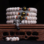 Star moon bodhi 108 bead meditation mala four wrap with black obsidian Om mantra beads silver Pixiu pendant on carved rosewood stand Taoist KaiGuang spiritual awakening cosmic energy