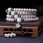 Star moon bodhi 108 bead meditation mala four wrap with white jade beads black sandalwood silver flower spacers and silver lotus pendant on rosewood stand Taoist KaiGuang mindful stillness