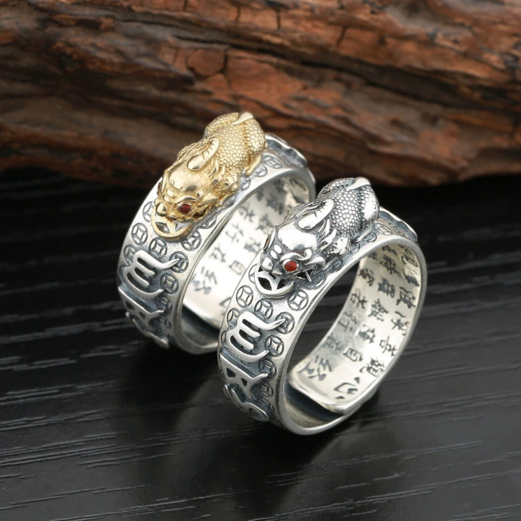 Sterling silver Pixiu fortune ring showing inner Taoist scripture engraving gold and silver versions dark wood