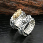 Sterling silver Pixiu fortune ring showing inner Taoist scripture engraving gold and silver versions dark wood