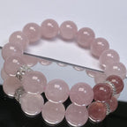 Close-up of natural strawberry quartz beads with sparkling internal inclusions.