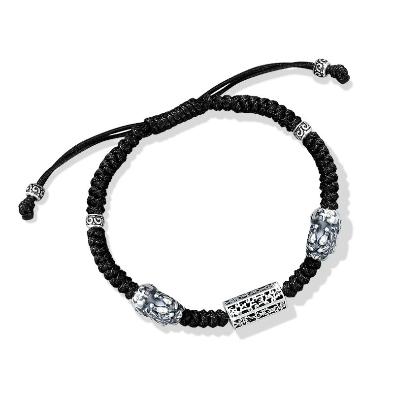 Taiji aura Pixiu bracelet adjustable black braided cord with sterling silver lock bead overhead view white background wealth guardian talisman