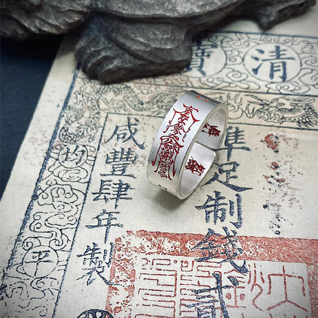 angled view of taoist protection ring showing engraved talisman details for energy shielding