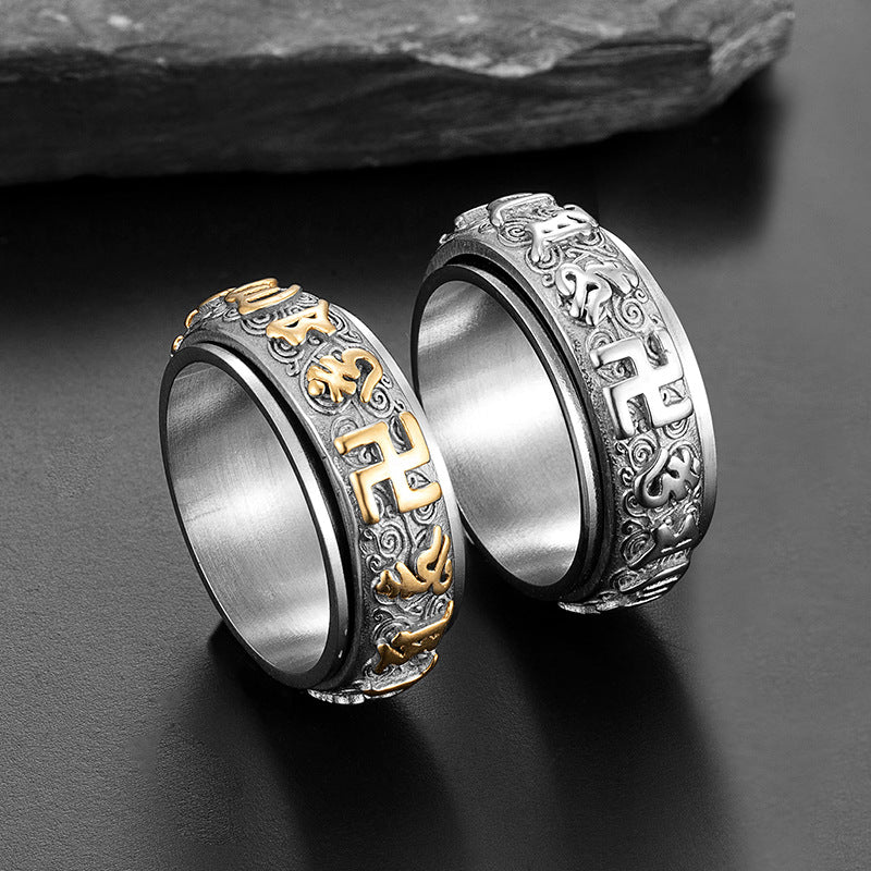 Two gold and silver Taoist spinner rings side view showing rotatable band and rune engravings