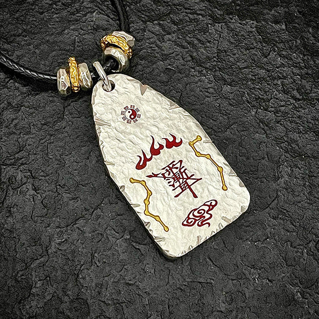 Macro view of the back of the hammered silver pendant featuring the supreme evil-banishing symbols and North Star formation.