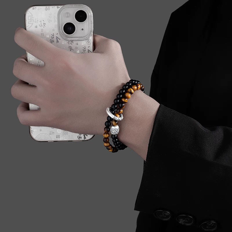 man wearing black obsidian tiger eye double layer bracelet taoist kaiguang protection fortune daily wear