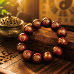 Thunderstruck jujube wood consecrated talisman bracelet on wooden stand with Taoist incense burner and yin-yang symbol
