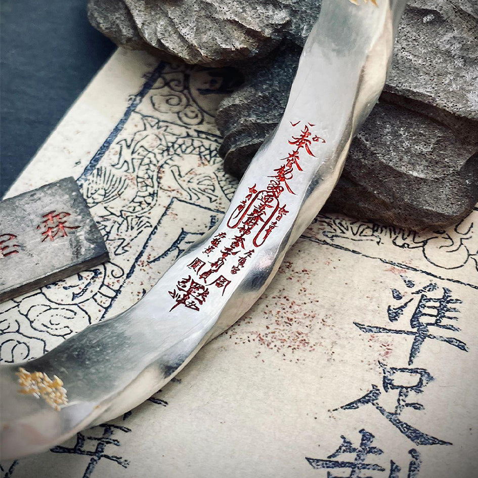 Macro shot focusing on the inner engraved Wealth Attraction Mantra, attracting benefactors, opportunities, and financial prosperity.