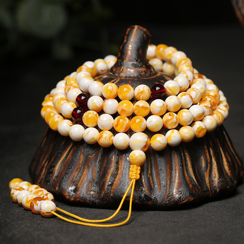 White Flower Beeswax 108 mala beads bracelet for sleep healing, insomnia relief, and meditation.
